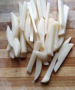 potatoes cut in thin strips for macher bati chorchori